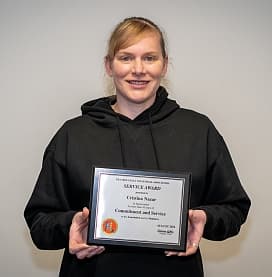 Cristina Nazar receiving the Crystal Service Award (2022)