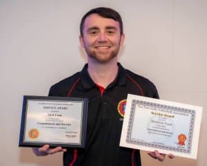 Matthew Cook receiving the Crystal Service Award (2021)
